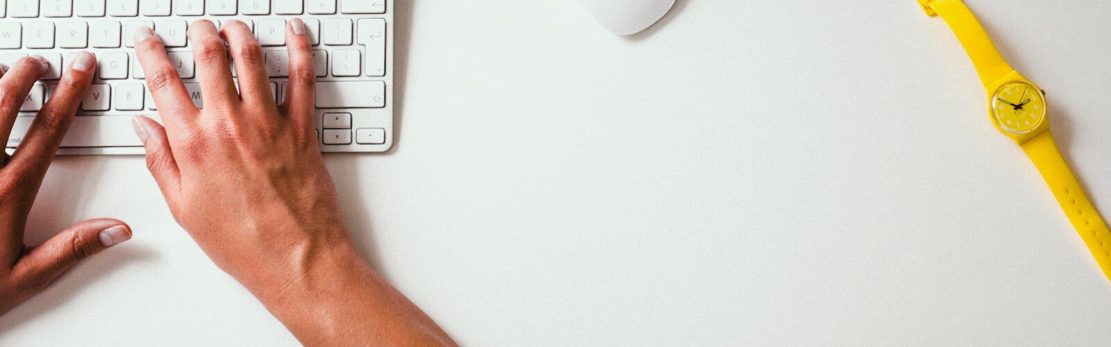 person typing on Apple Cordless Keyboard